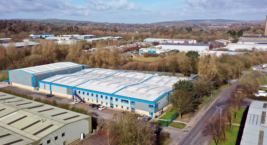 Photo: SGL Co-packing's sites at Nelson, Lancashire, UK.  SGL1 and Head Office is the blue-edged building in the centre, and part of SGL2 is just visible to the bottom right