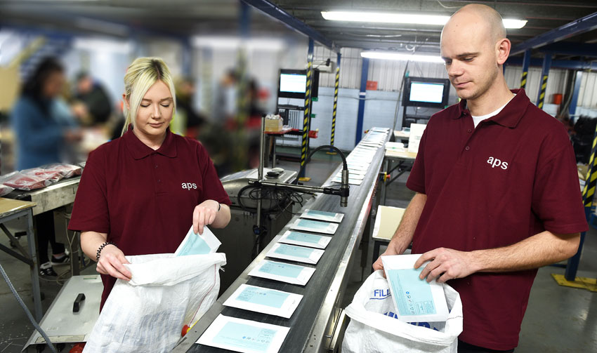 Staff at work inside APS's Blyth, Northumberland, contract packing and fulfilment centre